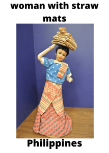 Philippines Woman With Straw Mats